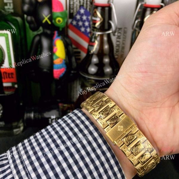 New Fake Patek Philippe Engraving Nautilus Silver Face Yellow Gold Watch For Sale New Fake Patek Philippe Engraving Nautilus Silver Face Yellow Gold Watch For Sale